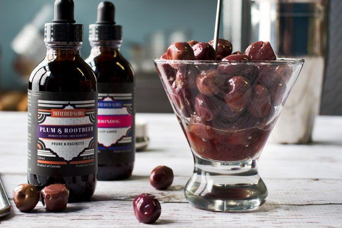 Bittered Sling photo with olives in bowls around it