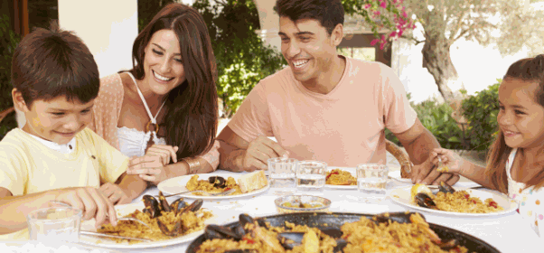 hispanic-family-enjoying-outdoor-meal-at-home-toge-P2FBBN6.png